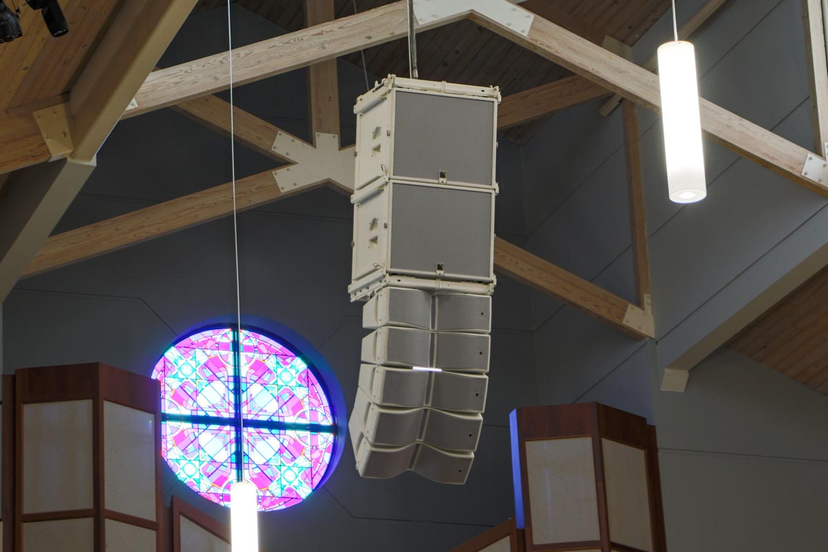 First Methodist Conroe main sanctuary white ceiling L-Acoustics speaker array and subwoofers